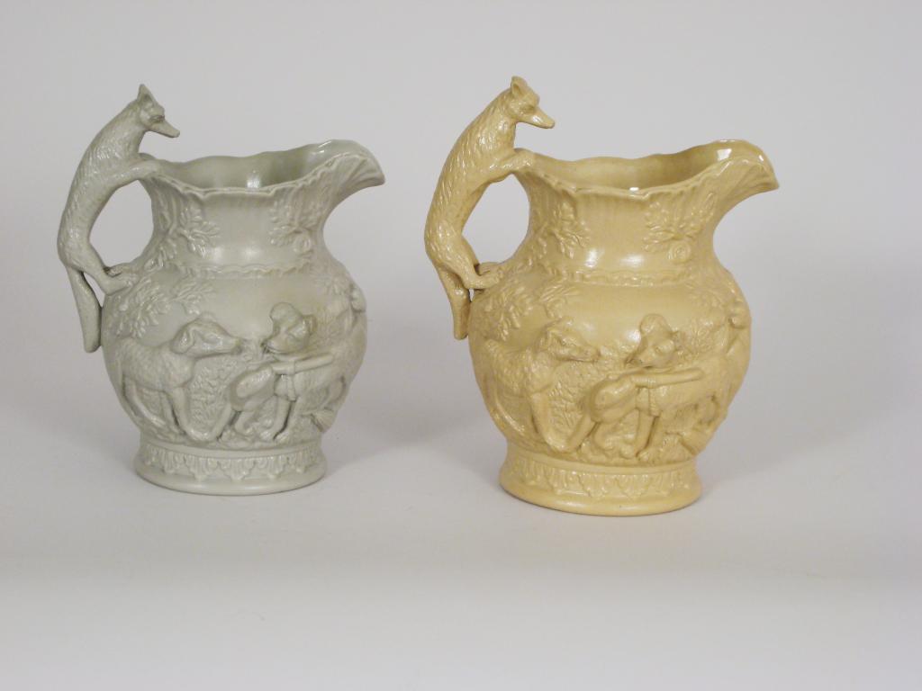 Appraisal: Two Victorian stoneware Jugs with moulded design in high relief