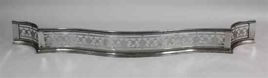 Appraisal: A George III serpentine and pierced steel fender decorated with