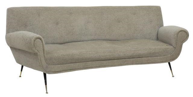 Appraisal: Italian mid-century modern three-seat sofa c s curved padded and