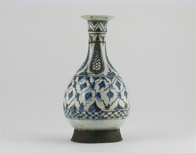 Appraisal: A Middle Eastern pottery bottle painted in blue and black