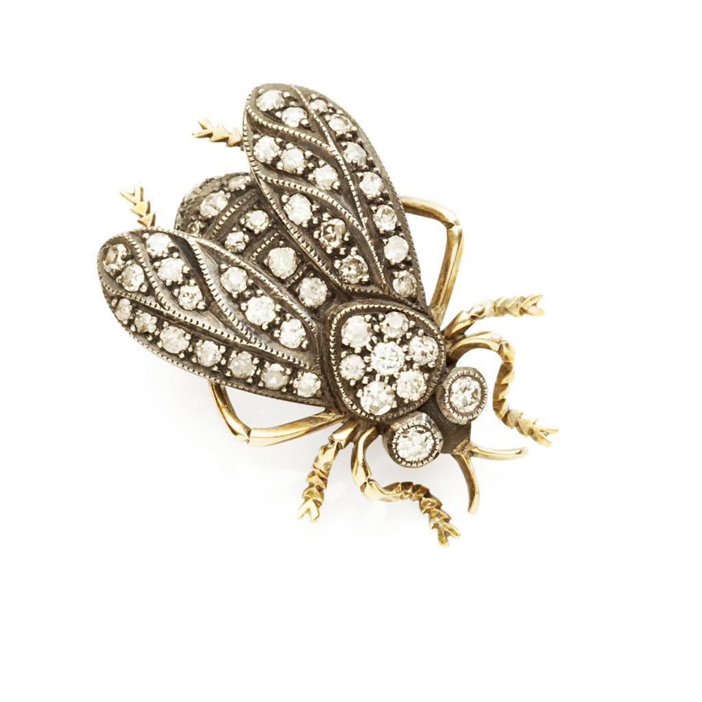 Appraisal: A diamond set novelty brooch modelled in white metal as