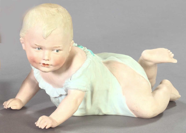 Appraisal: German Polychromed Biscuit Porcelain Figure of a Crawling Baby first