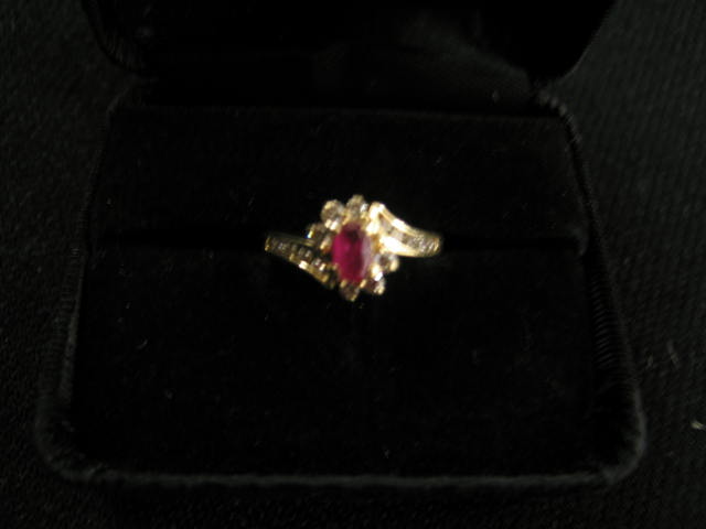 Appraisal: Ruby Diamond Ring oval ruby surrounded by diamonds in k