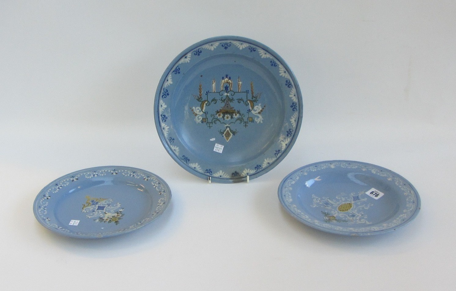 Appraisal: Three Pavia berettino-ground circular dishes early th century variously painted