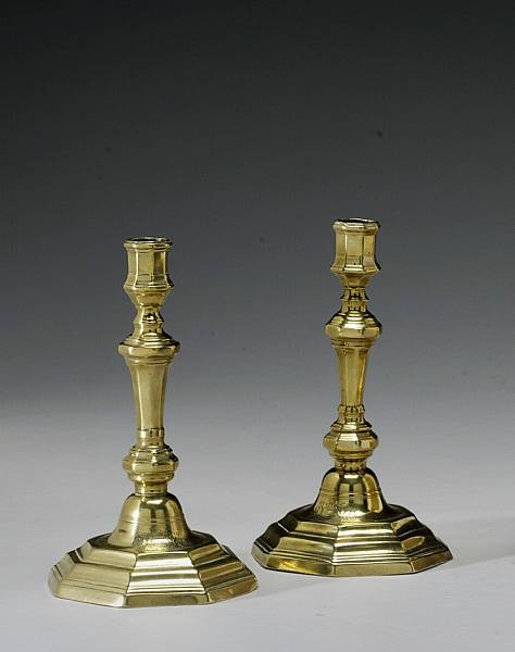 Appraisal: A pair of Louis XV brass armorial candlesticks mid th