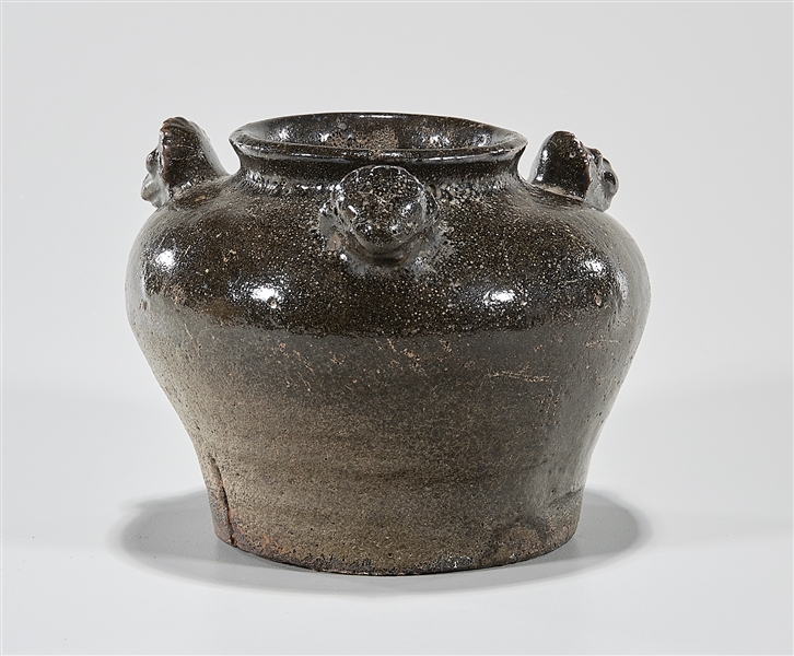 Appraisal: Korean celadon brown glazed jarlet with three molded masks to