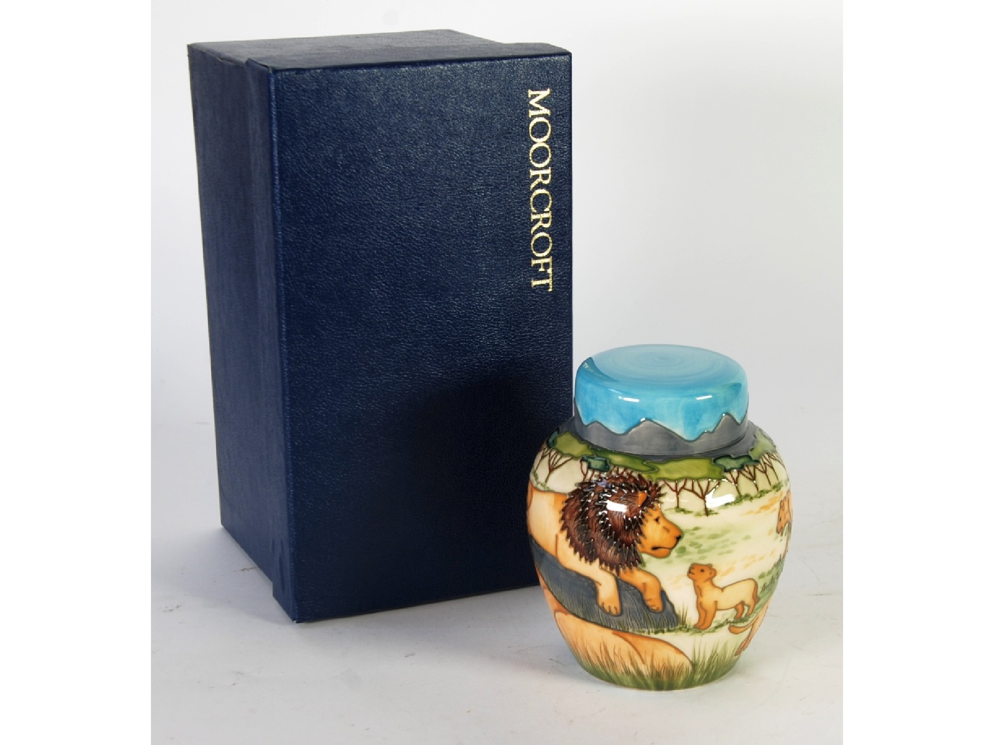 Appraisal: A LIMITED EDITION MODERN MOORCROFT PRIDE OF LIONS PATTERN TUBE