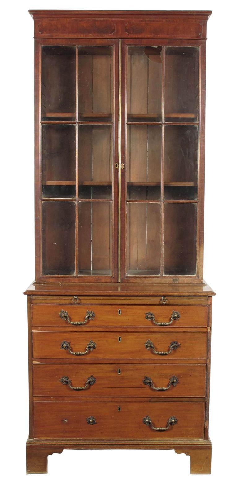 Appraisal: A mahogany cabinet on chest