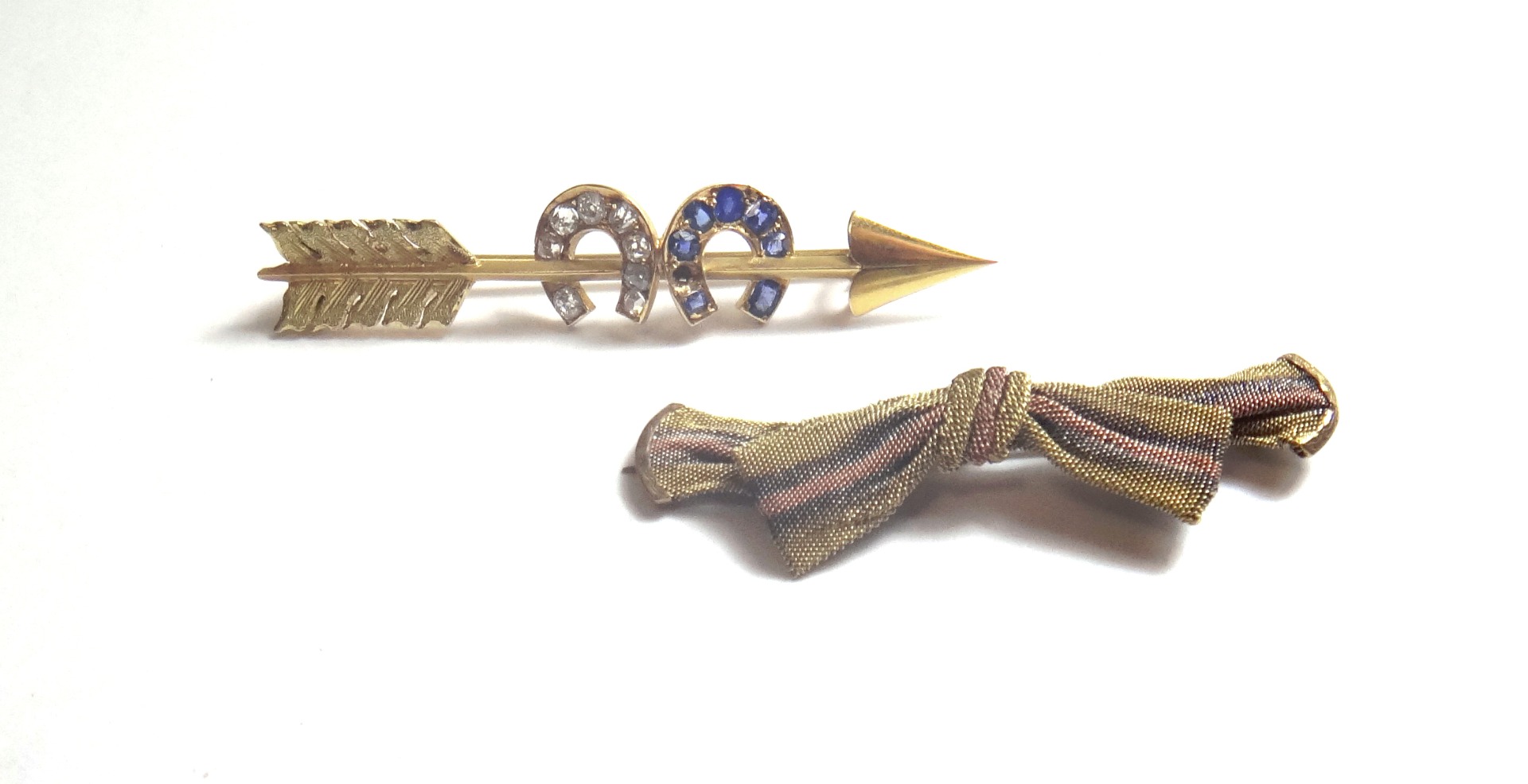 Appraisal: A gold diamond and sapphire set brooch designed as an