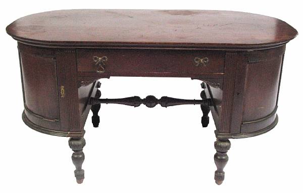 Appraisal: A George III style mahogany kneehole desk early th century