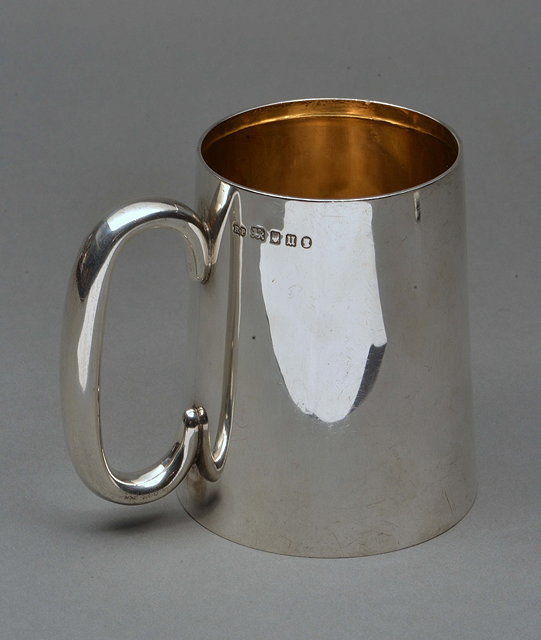 Appraisal: A PLAIN SILVER TANKARD of waisted form with gilt interior