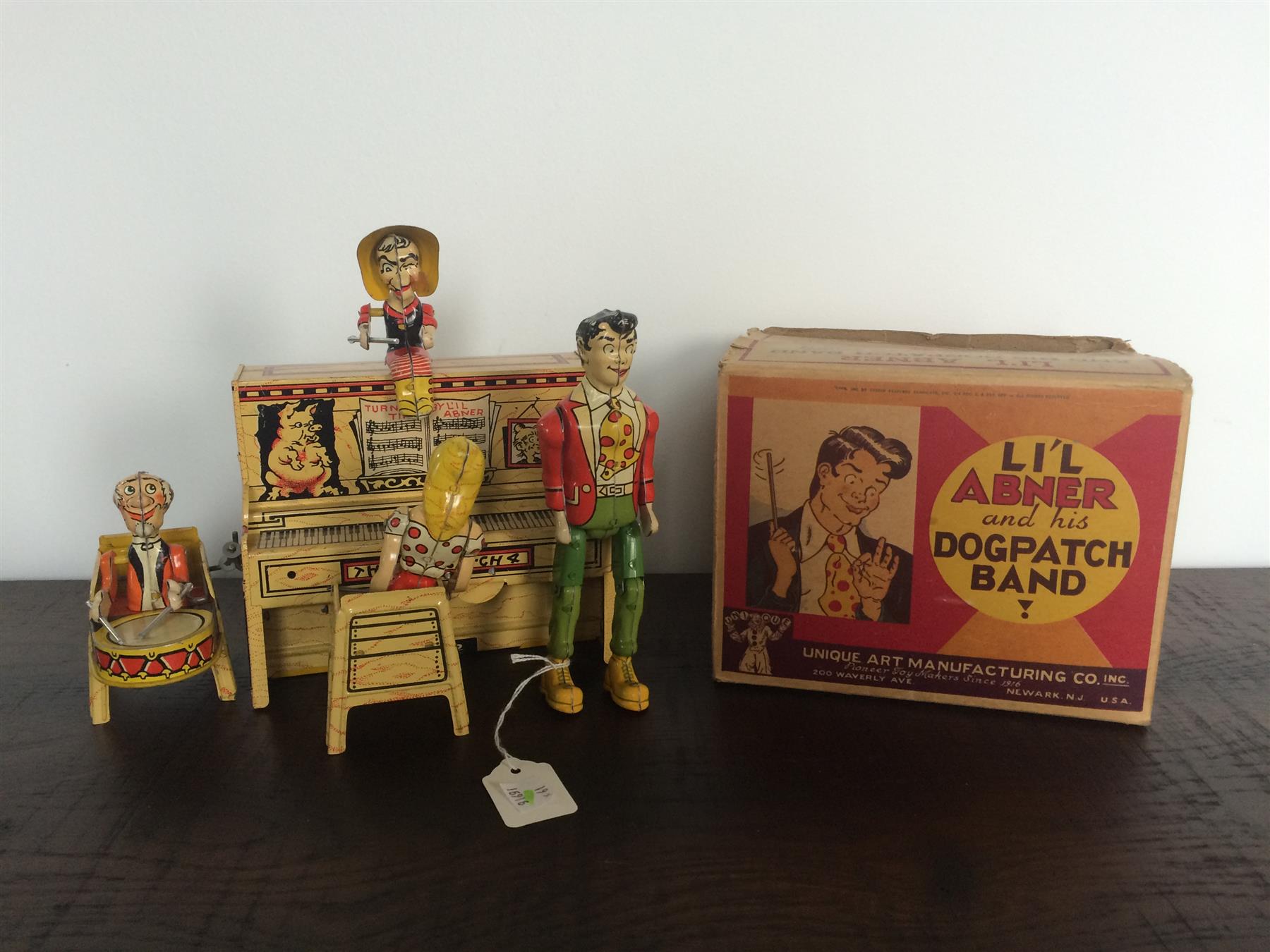 Appraisal: LI'L ABNER AND HIS DOGPATCH BAND WIND UP TOY American