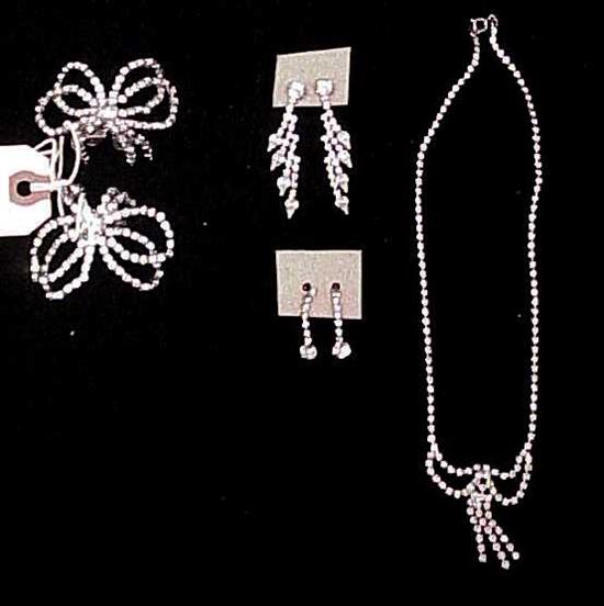 Appraisal: JEWELRY Two Musi rhinestone clips a rhinestone necklace and two