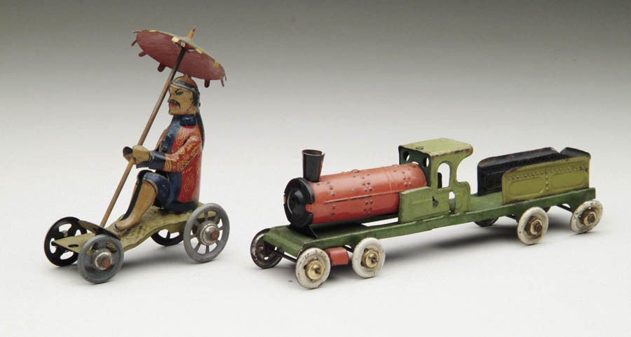 Appraisal: LOT OF TWO GERMAN PENNY TOYS Consisting of train with