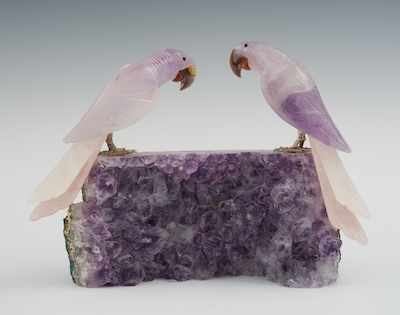 Appraisal: An Amethyst Geode with Two Carved Parrots A natural section