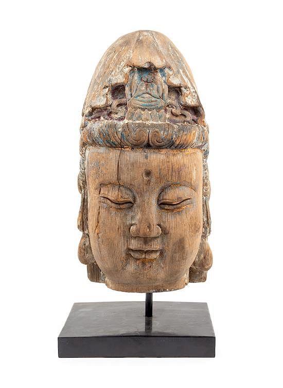 Appraisal: A Large Carved Wood Head of Guanyin Height inches A