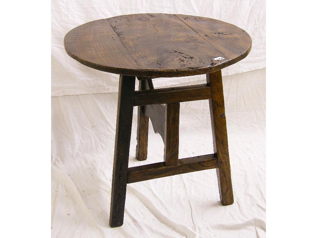 Appraisal: Antique rustic elm cricket table supported upon three pegged legs