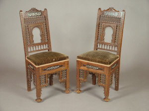 Appraisal: A pair of walnut Moorish style side chairs early th