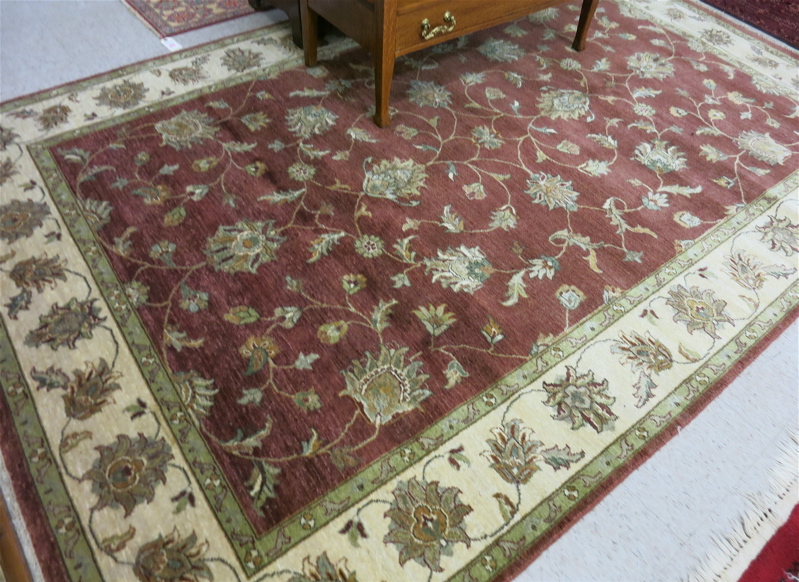 Appraisal: HAND KNOTTED ORIENTAL CARPET Indo-Persian overall floral Isfahan design on