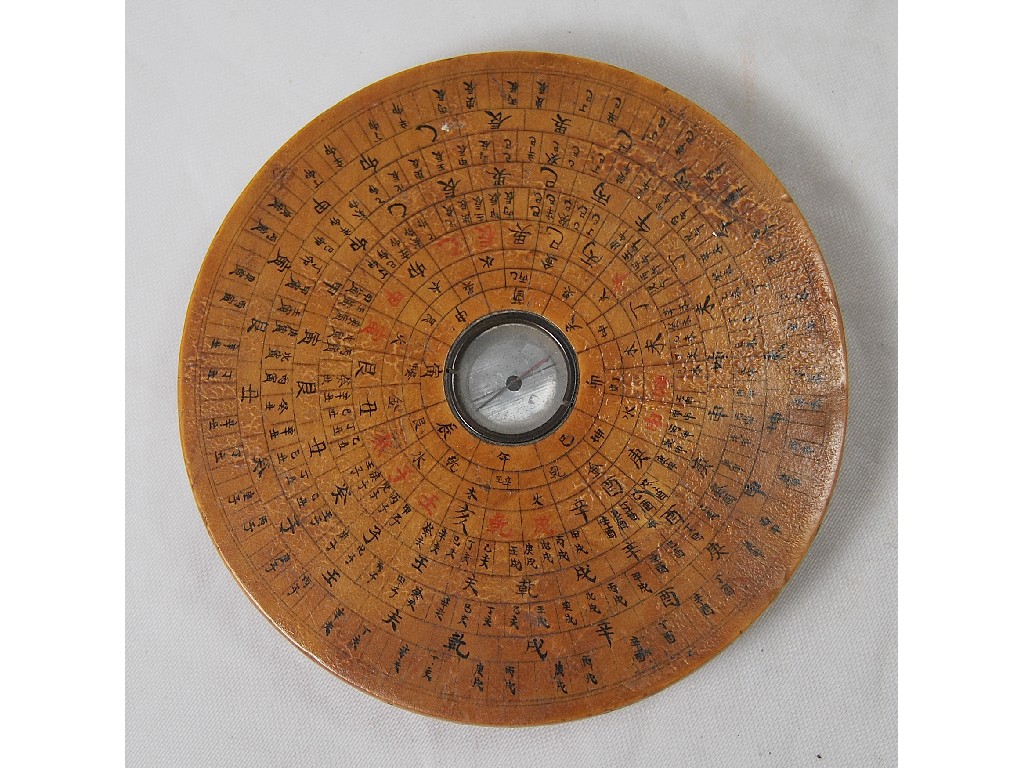 Appraisal: A th century Chinese turned wood dish compass with penwork