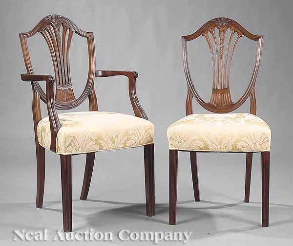 Appraisal: A Pair of George III-Style Carved Mahogany Dining Chairs each