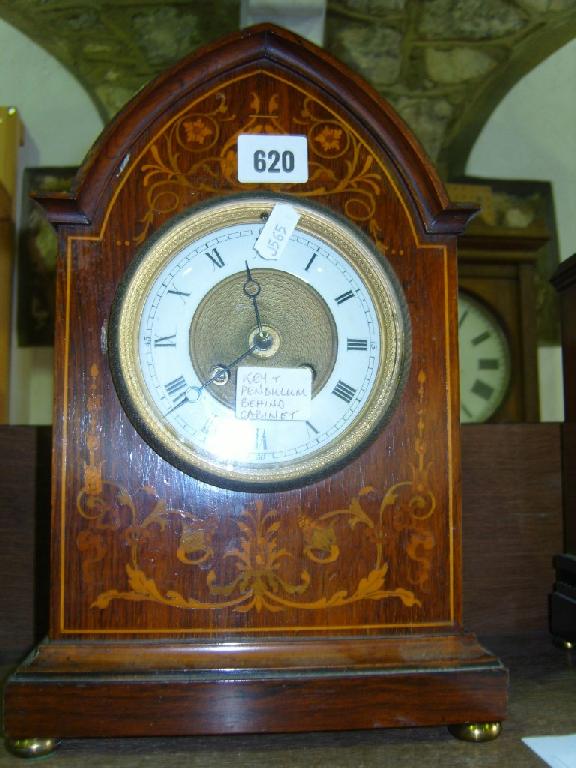 Appraisal: An Edwardian rosewood veneered mantle clock of lancet shape with