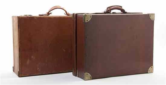 Appraisal: Two Leather Bound Suitcases one with built-in oak compartments for