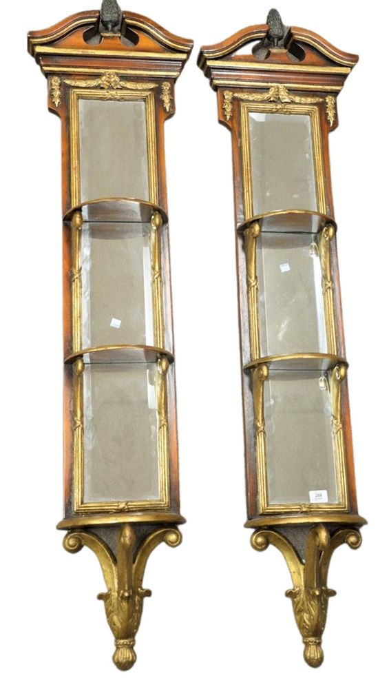 Appraisal: Pair of carved and gilt hanging shelves having mirrored backs