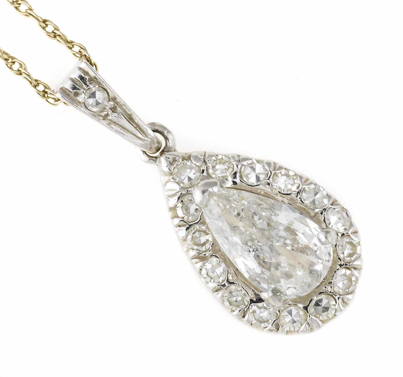 Appraisal: A diamond pendant with chain centering a pear-shaped diamond estimated