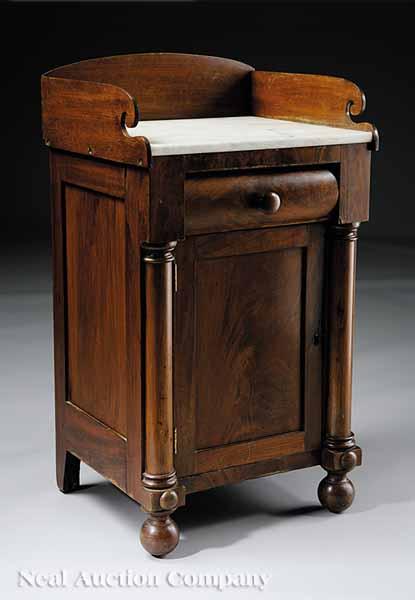 Appraisal: An American Classical Mahogany Washstand c Boston the arched backsplash