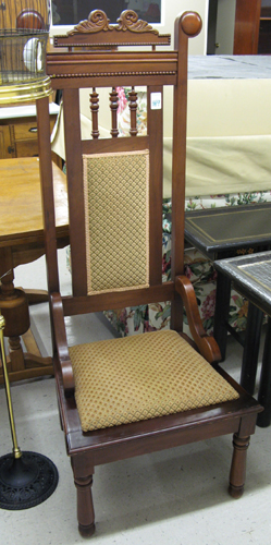 Appraisal: A HIGH-BACK WALNUT AND MAHOGANY HALL CHAIR The back has