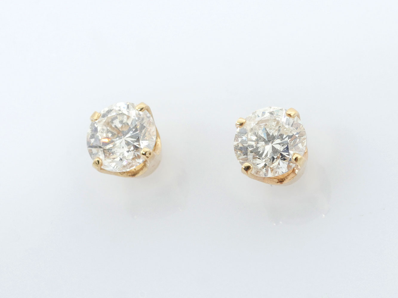 Appraisal: K CTW DIAMOND EAR STUDS K yellow gold solitaire earrings