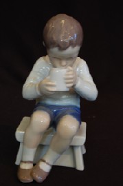 Appraisal: B G FIGURE OF A YOUNG BOY