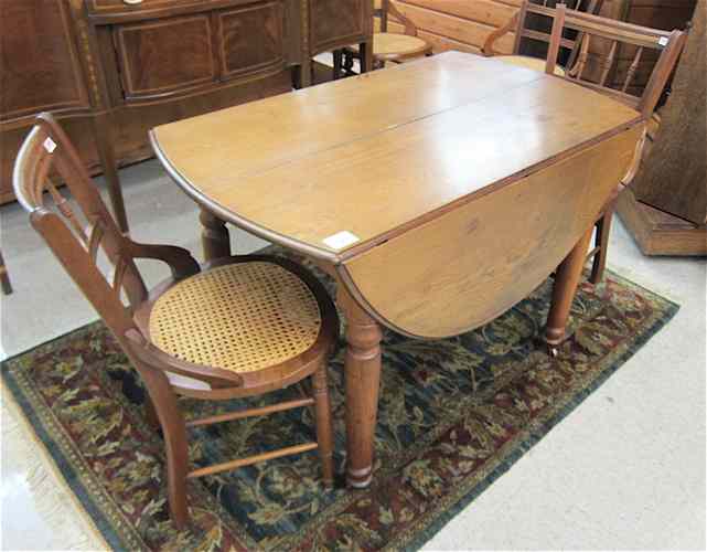 Appraisal: A VICTORIAN WALNUT DINING TABLE AND FOUR CHAIRS American last