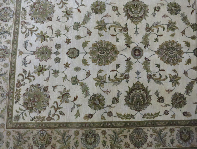 Appraisal: HAND KNOTTED ORIENTAL CARPET Indo-Persian floral Isfahan design on cream