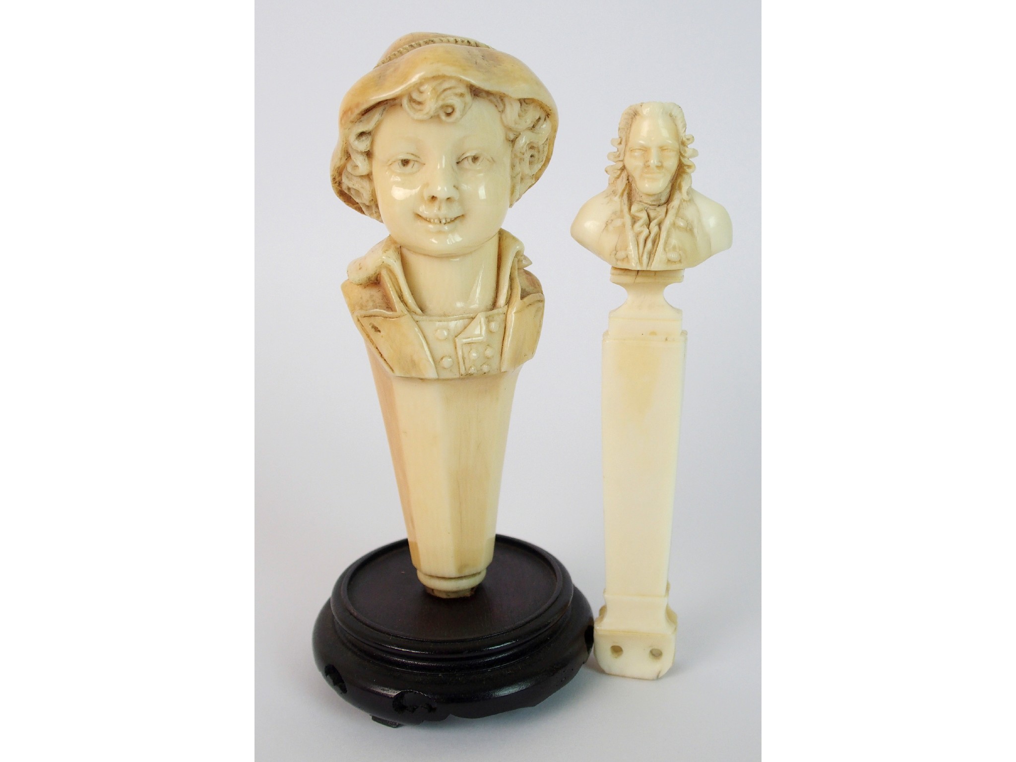 Appraisal: A th Century carved ivory boy figure cane handlethe ivory