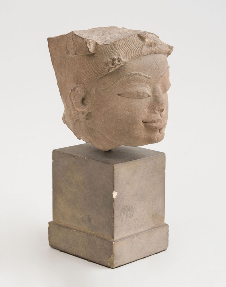 Appraisal: INDIAN CARVED GREY SCHIST HEAD OF A FEMALE in Provenance