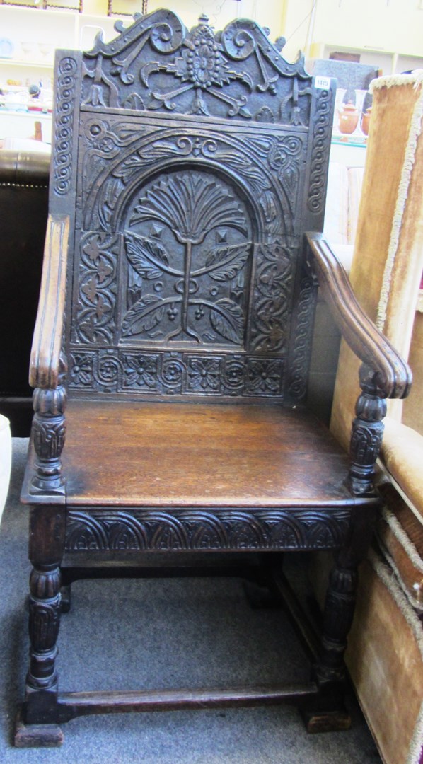 Appraisal: A th century and later oak Wainscot open armchair with