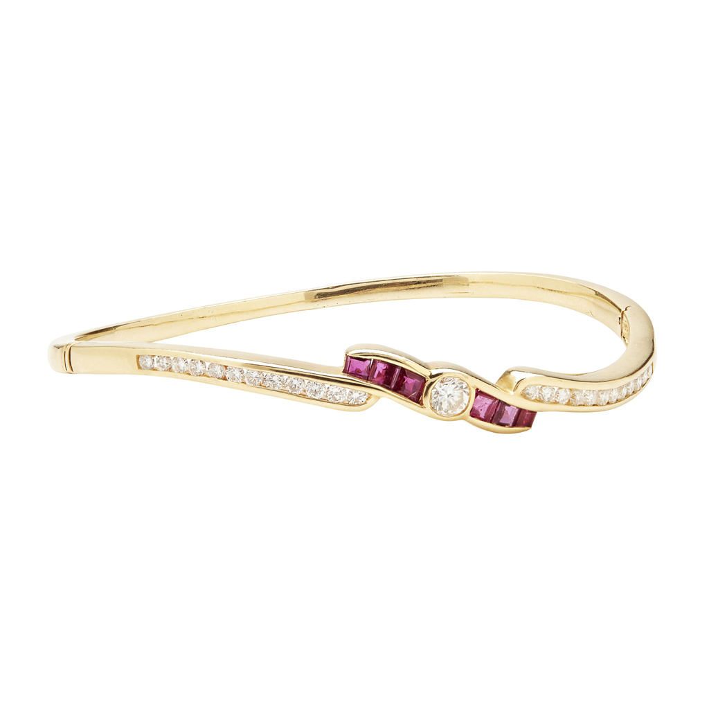 Appraisal: A ruby and diamond set bangle of hinged design collet