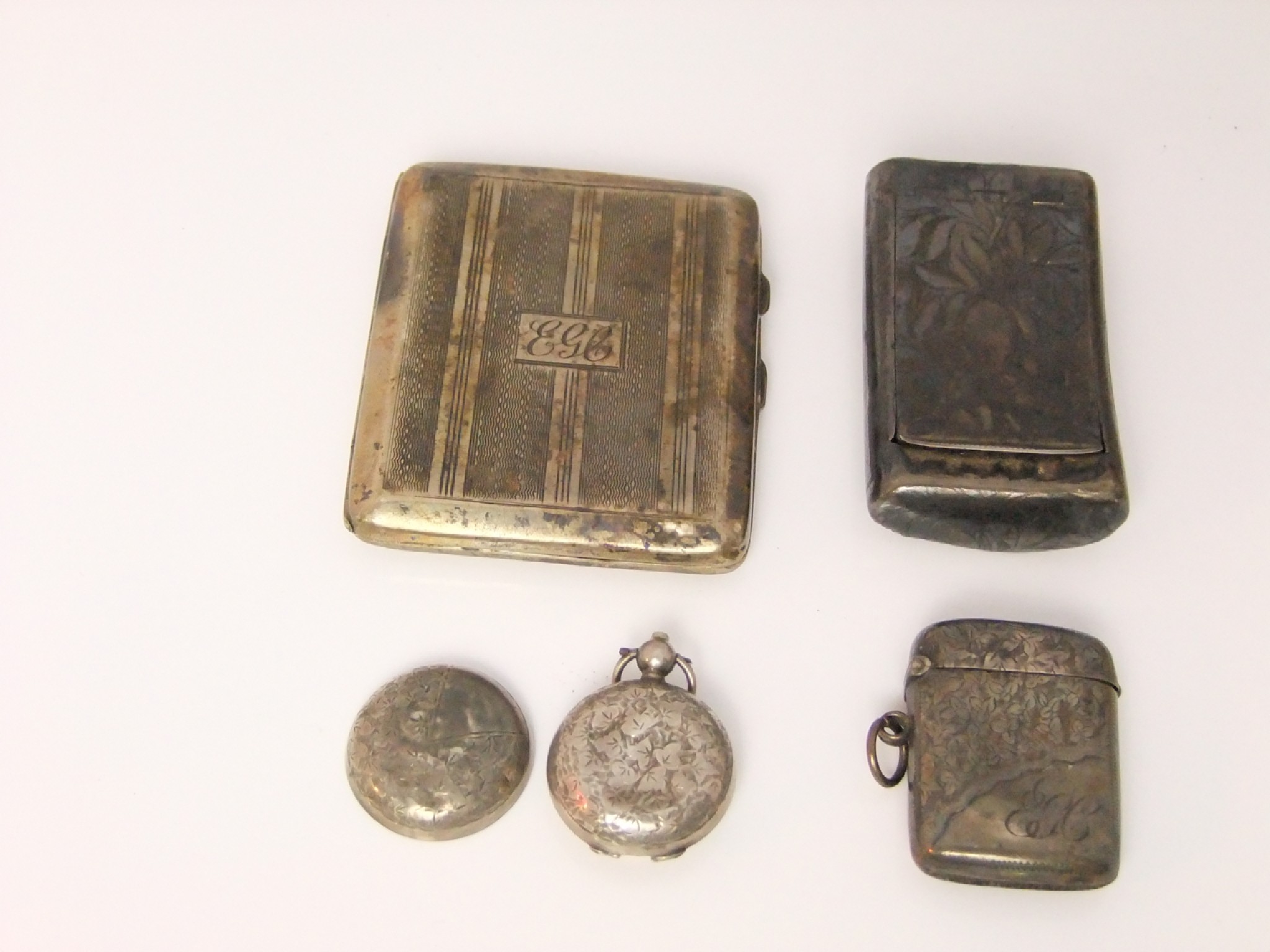 Appraisal: A silver cigarette case snuff box vesta and sovereign case