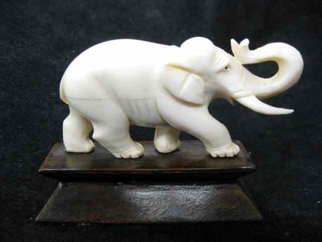 Appraisal: Carved Ivory Figurine of an Elephant '' long wooden base