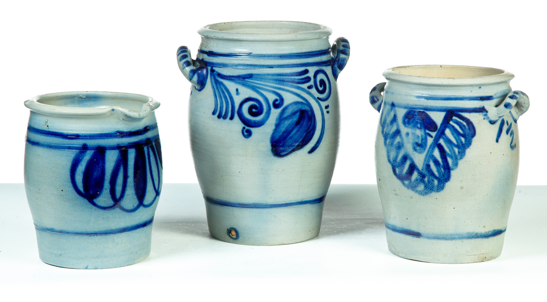 Appraisal: THREE GERMAN STONEWARE PIECES Nineteenth century Salt glaze with freehand