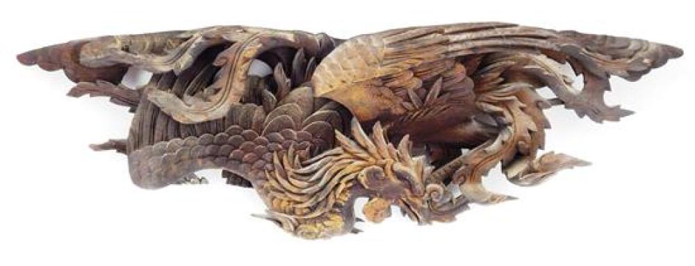 Appraisal: Carved wood relief of a phoenix the head bends under