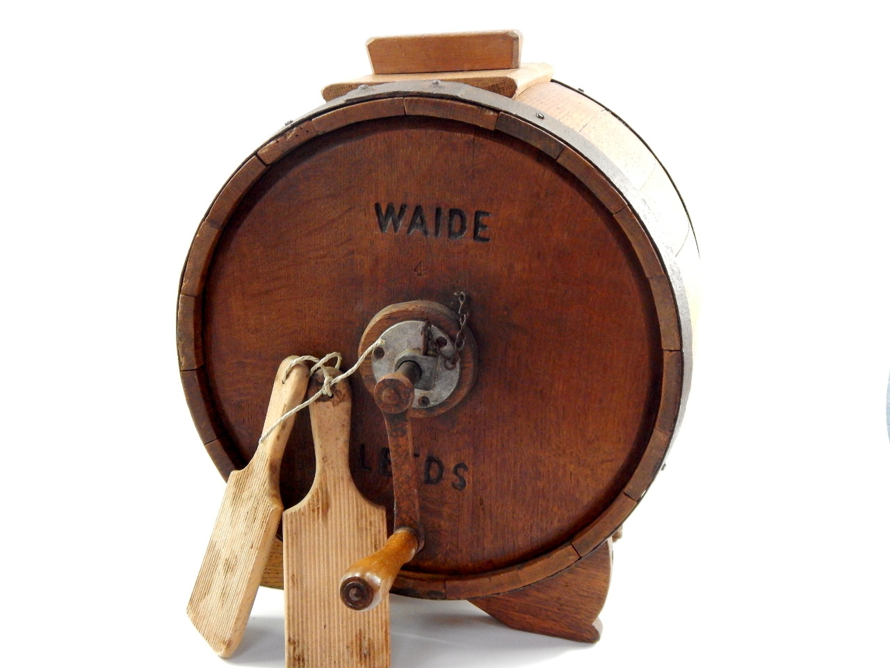 Appraisal: A Waide Leeds oak butter churn with pats cm diameter