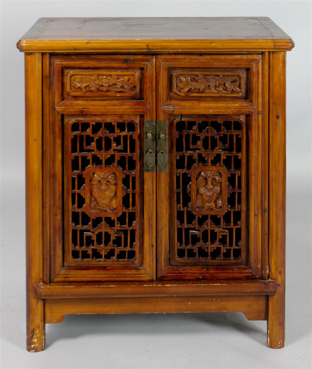 Appraisal: PETITE INDONESIAN CARVED HARDWOOD CABINET molded top over double carved