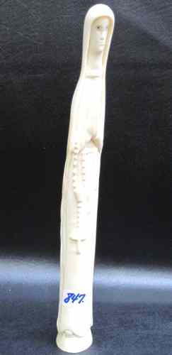 Appraisal: AN AFRICAN IVORY CARVED FIGURE depicting a missionary nun with