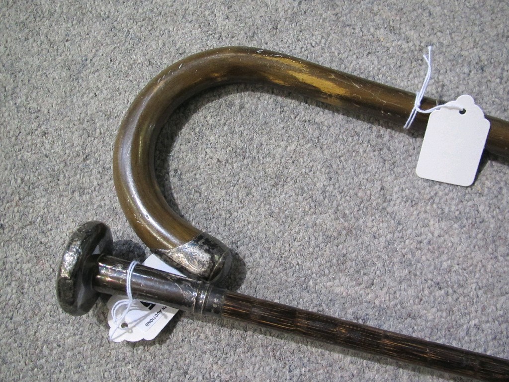 Appraisal: Lot comprising silver handled parasol and a walking stick