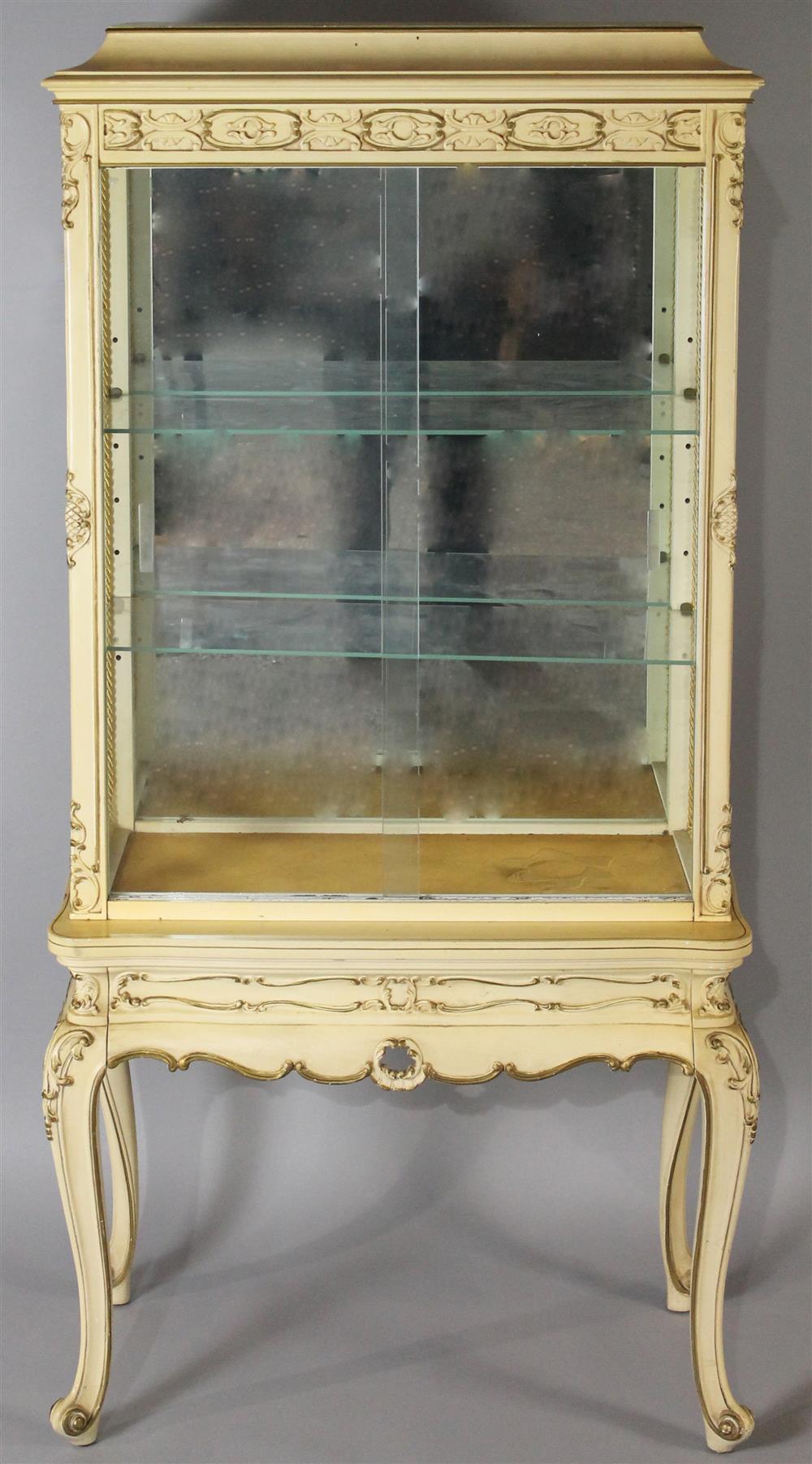 Appraisal: CREAM PAINTED FRENCH STYLE CURIO CABINET LIGHTED WITH GLASS SIDES