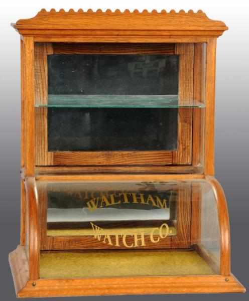 Appraisal: Curved Glass Waltham Watch Co Display Case Description Oak Unusual