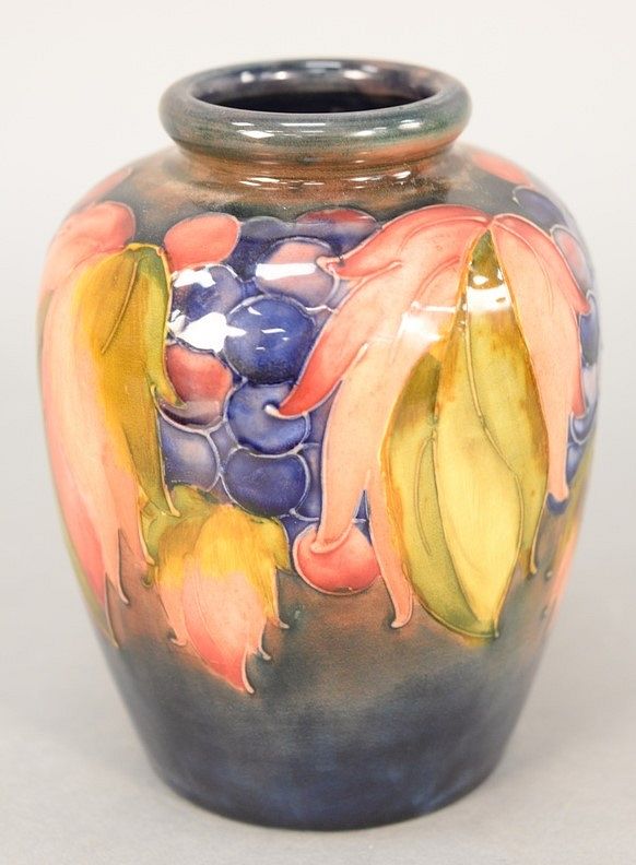 Appraisal: Moorcroft Pottery vase decorated with flowers and grapes marked Moorcroft